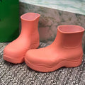 BOTTEGA VENETA PUDDLE ANKLE BOOT IN PUNCH PINK RUBBER